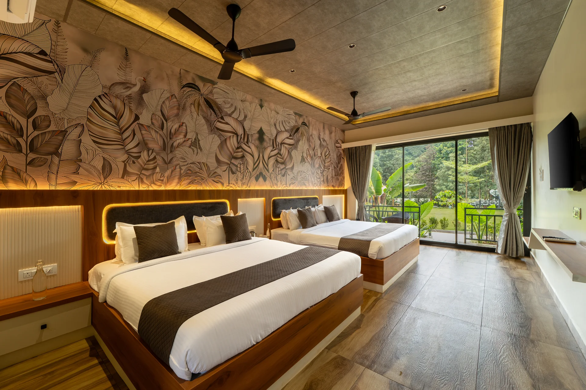 A premium cottage bedroom at Nadi Teera.